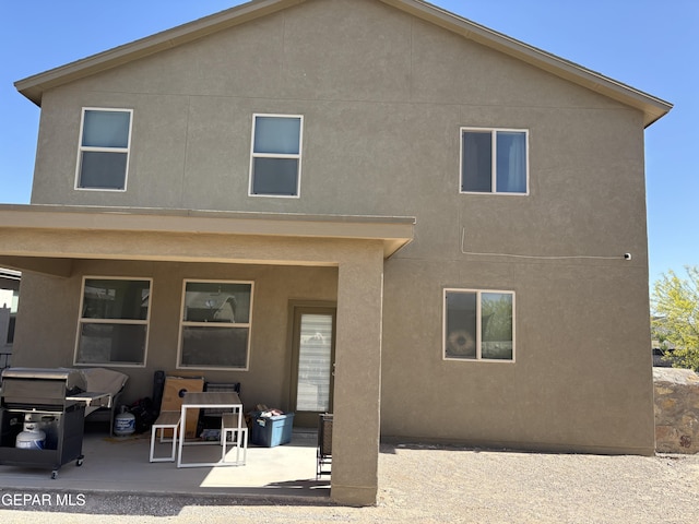 12301 Desert Heights Ct, El Paso, TX 79938 - back of property with a patio area and stucco siding