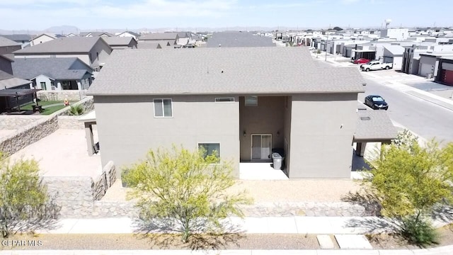 12301 Desert Heights Ct, El Paso, TX 79938 - back of house with stucco siding and a shingled roof