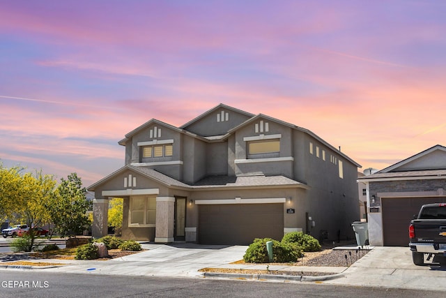 12301 Desert Heights Ct, El Paso, TX 79938 - view of front facade with concrete driveway, stucco siding, and a garage
