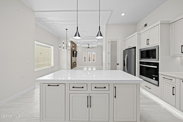 13391 Jeff Winton Dr, El Paso, TX 79928 - kitchen featuring stainless steel appliances, a kitchen island, white cabinets, light stone countertops, and decorative light fixtures
