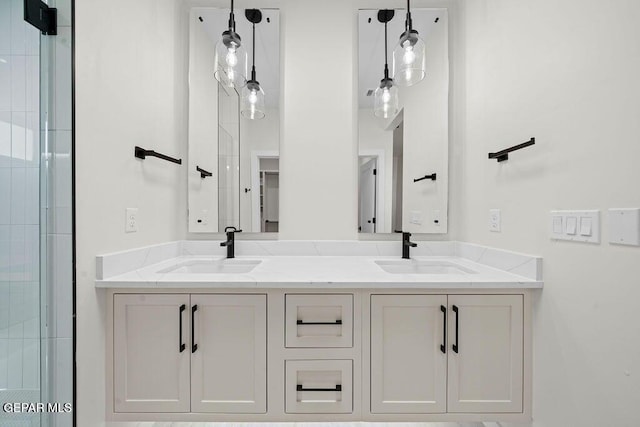 13391 Jeff Winton Dr, El Paso, TX 79928 - bathroom featuring double vanity and a tile shower