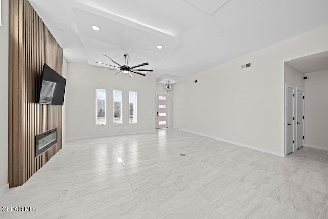 13391 Jeff Winton Dr, El Paso, TX 79928 - unfurnished living room featuring ceiling fan, recessed lighting, baseboards, and a glass covered fireplace