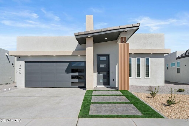 13391 Jeff Winton Dr, El Paso, TX 79928 - modern home featuring stucco siding, driveway, and an attached garage
