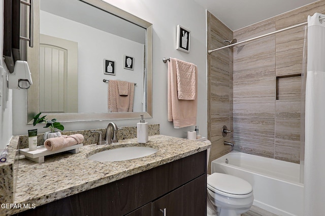 533 Cedarwood Ave, El Paso, TX 79928 - bathroom featuring vanity, shower / bath combo, and toilet