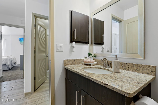 533 Cedarwood Ave, El Paso, TX 79928 - bathroom with vanity and wood finished floors