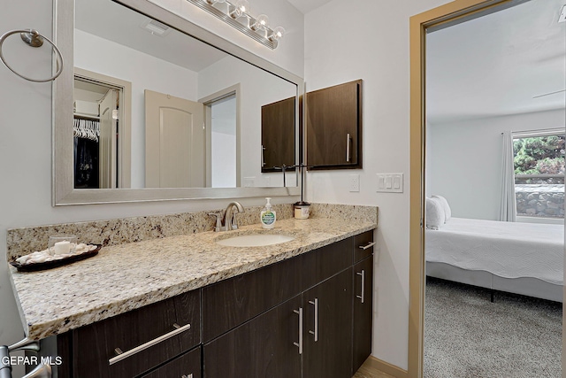 533 Cedarwood Ave, El Paso, TX 79928 - bathroom featuring vanity and connected bathroom
