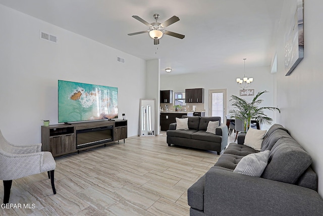 533 Cedarwood Ave, El Paso, TX 79928 - living area with a chandelier and ceiling fan