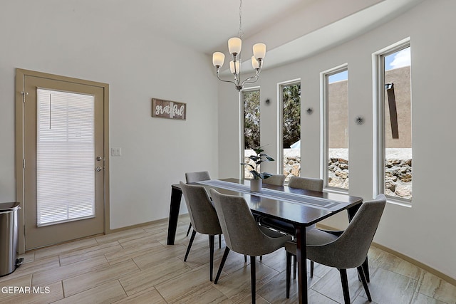 533 Cedarwood Ave, El Paso, TX 79928 - dining room featuring a chandelier, light wood-type flooring, and baseboards