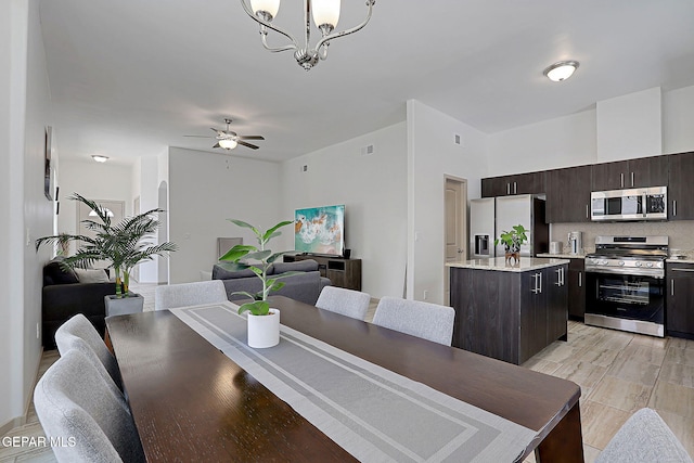 533 Cedarwood Ave, El Paso, TX 79928 - dining room with a chandelier and ceiling fan