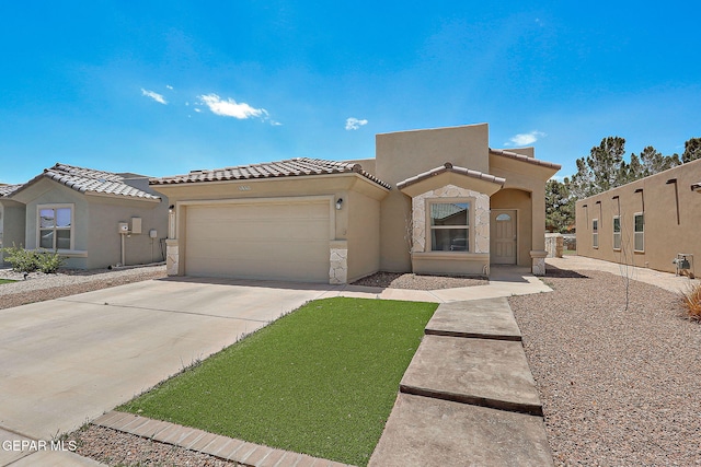 533 Cedarwood Ave, El Paso, TX 79928 - view of front of property featuring a garage, stucco siding, driveway, and a tiled roof