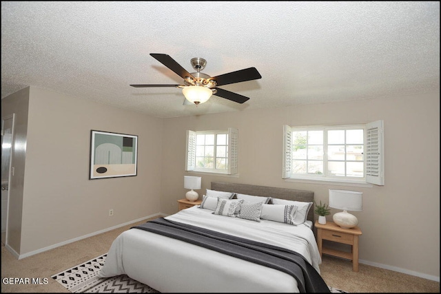 212 Paso Noble Dr, El Paso, TX 79912 - carpeted bedroom featuring baseboards, a textured ceiling, and ceiling fan