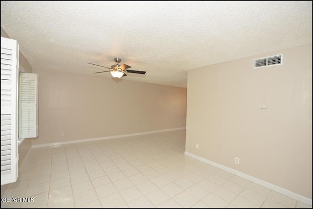 212 Paso Noble Dr, El Paso, TX 79912 - unfurnished room with a ceiling fan, baseboards, a textured ceiling, and light tile patterned floors