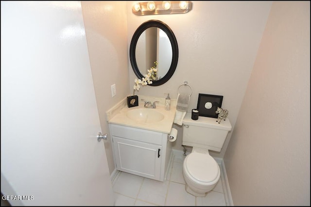 212 Paso Noble Dr, El Paso, TX 79912 - half bath with tile patterned flooring, vanity, toilet, and baseboards
