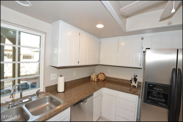 212 Paso Noble Dr, El Paso, TX 79912 - kitchen with appliances with stainless steel finishes, a sink, white cabinets, recessed lighting, and dark stone countertops