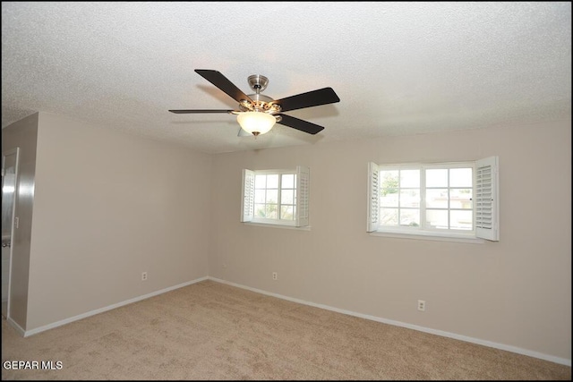 212 Paso Noble Dr, El Paso, TX 79912 - empty room featuring ceiling fan, light colored carpet, baseboards, and a textured ceiling