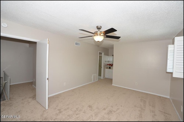 212 Paso Noble Dr, El Paso, TX 79912 - unfurnished room featuring a ceiling fan, carpet flooring, baseboards, and a textured ceiling