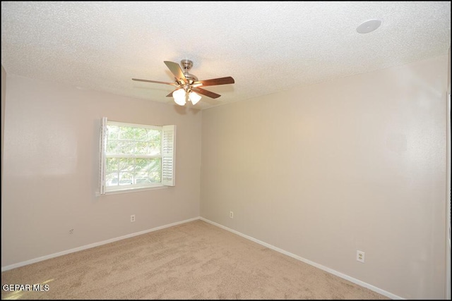 212 Paso Noble Dr, El Paso, TX 79912 - spare room with ceiling fan, light carpet, baseboards, and a textured ceiling