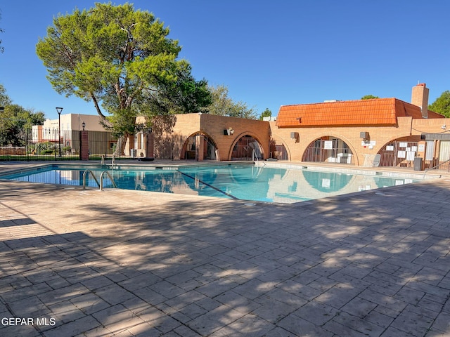 212 Paso Noble Dr, El Paso, TX 79912 - community pool featuring a patio area