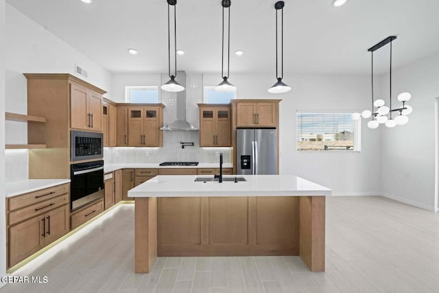13399 Jeff Winton Dr, El Paso, TX 79928 - kitchen featuring appliances with stainless steel finishes, a sink, wall chimney range hood, open shelves, and backsplash