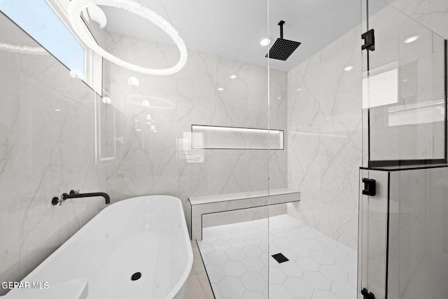 13399 Jeff Winton Dr, El Paso, TX 79928 - bathroom featuring tile walls, a freestanding tub, and a marble finish shower