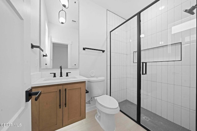 13399 Jeff Winton Dr, El Paso, TX 79928 - full bathroom featuring toilet, vanity, and a shower stall