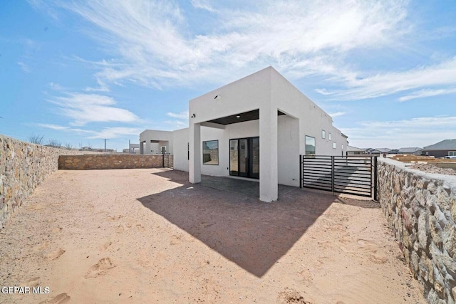 13399 Jeff Winton Dr, El Paso, TX 79928 - rear view of property with stucco siding and a fenced backyard