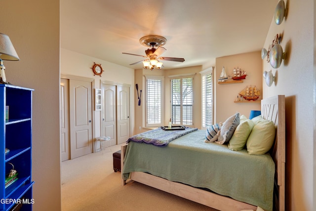 7301 Brays Landing Dr, El Paso, TX 79911 - bedroom featuring carpet, multiple closets, and ceiling fan