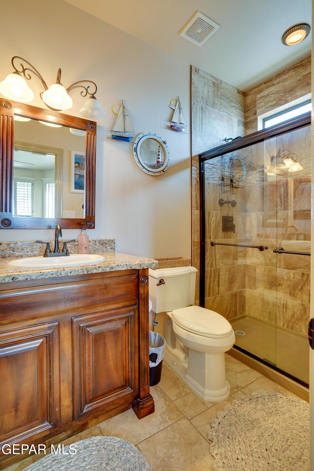 7301 Brays Landing Dr, El Paso, TX 79911 - full bathroom with toilet, a stall shower, vanity, and tile patterned floors