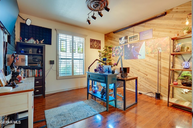 7301 Brays Landing Dr, El Paso, TX 79911 - office with wood walls, wood finished floors, and baseboards