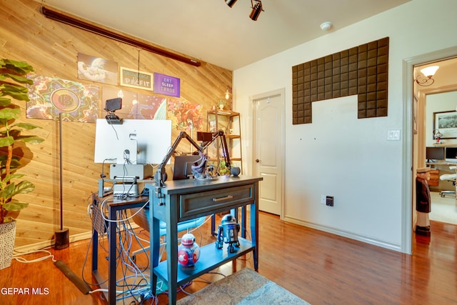 7301 Brays Landing Dr, El Paso, TX 79911 - office space featuring wooden walls, wood finished floors, and baseboards