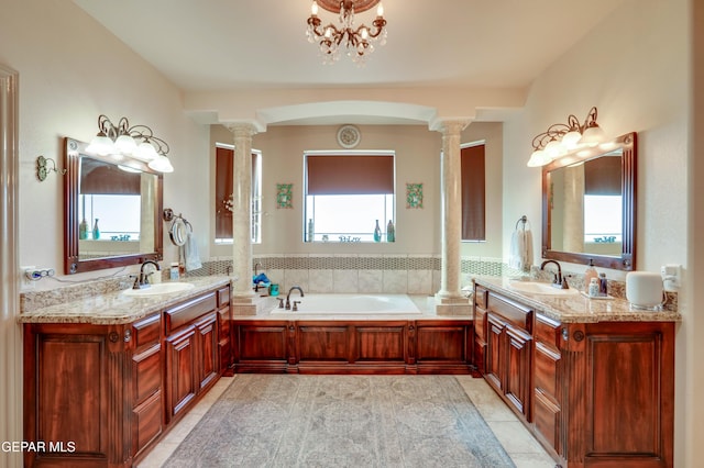 7301 Brays Landing Dr, El Paso, TX 79911 - bathroom with ornate columns, tile patterned floors, and two vanities