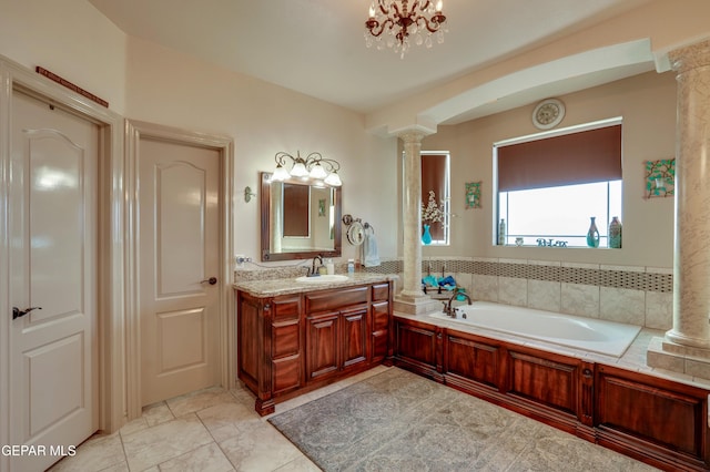 7301 Brays Landing Dr, El Paso, TX 79911 - full bathroom featuring decorative columns, vanity, a bath, and tile patterned floors