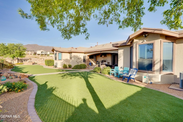 7301 Brays Landing Dr, El Paso, TX 79911 - view of grassy yard featuring a patio and an area to practice putting