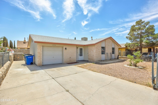 10704 Quartz St, El Paso, TX 79924 - view of front of home featuring brick siding, an attached garage, and concrete driveway