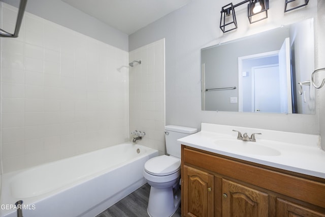 10704 Quartz St, El Paso, TX 79924 - full bathroom featuring vanity, toilet, bathing tub / shower combination, and wood finished floors