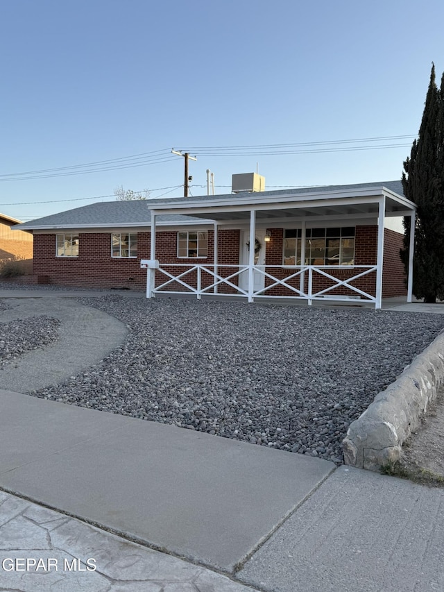6220 Bel Mar Ave, El Paso, TX 79912 - ranch-style home featuring brick siding and a porch