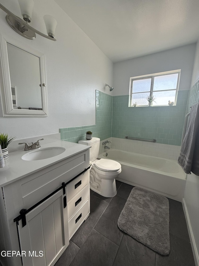 6220 Bel Mar Ave, El Paso, TX 79912 - full bath with vanity, shower / bathtub combination, toilet, and tile patterned floors