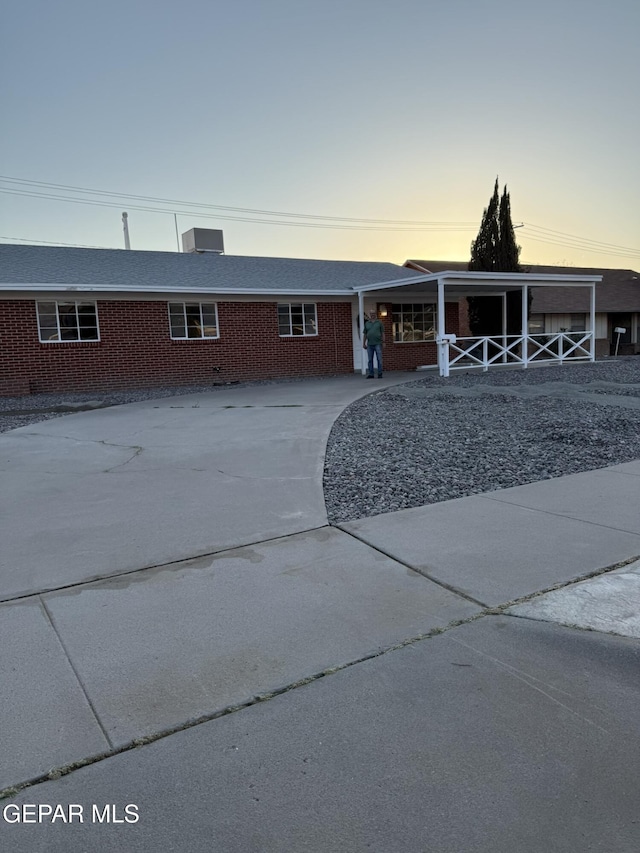 6220 Bel Mar Ave, El Paso, TX 79912 - view of front facade with brick siding and driveway