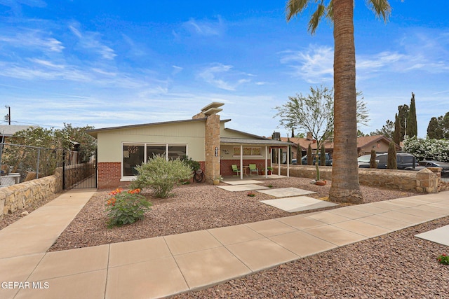 4012 Hastings Dr, El Paso, TX 79903 - view of front of home with brick siding and a gate
