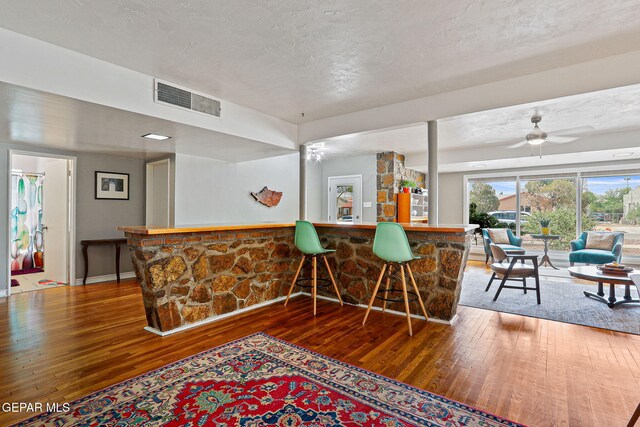 4012 Hastings Dr, El Paso, TX 79903 - indoor dry bar with hardwood / wood-style floors, a textured ceiling, and a ceiling fan