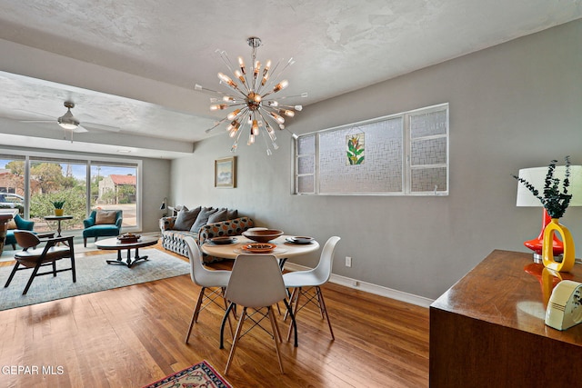 4012 Hastings Dr, El Paso, TX 79903 - dining room featuring hardwood / wood-style flooring, baseboards, a chandelier, and a ceiling fan