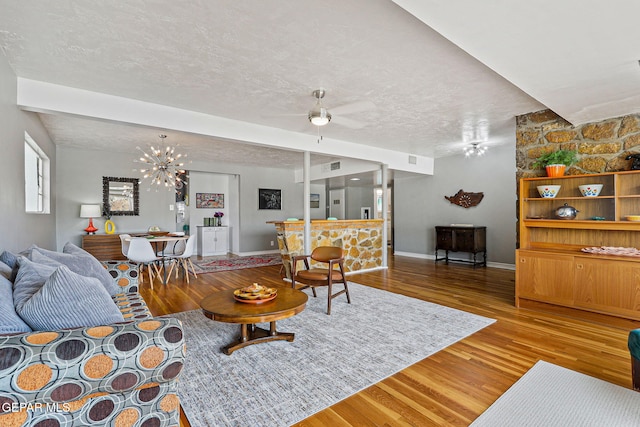 4012 Hastings Dr, El Paso, TX 79903 - living area with a textured ceiling, wood finished floors, baseboards, and a ceiling fan
