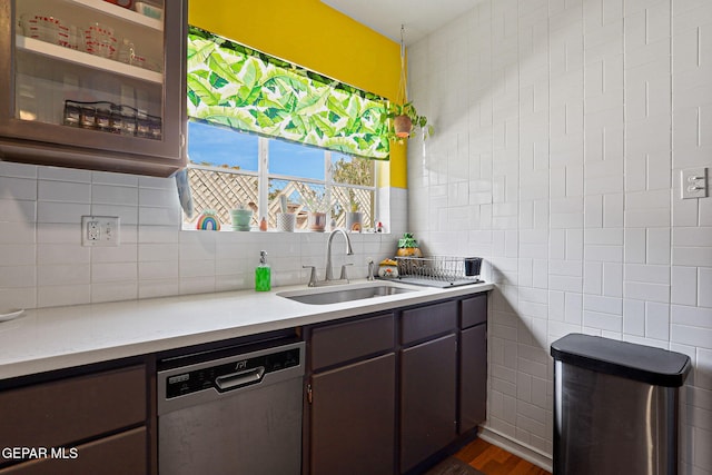 4012 Hastings Dr, El Paso, TX 79903 - kitchen with dishwasher, a sink, light countertops, tile walls, and backsplash
