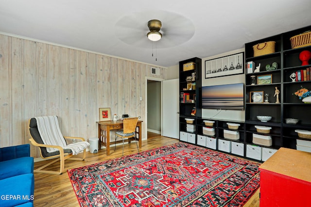4012 Hastings Dr, El Paso, TX 79903 - home office with wooden walls, ceiling fan, and wood finished floors