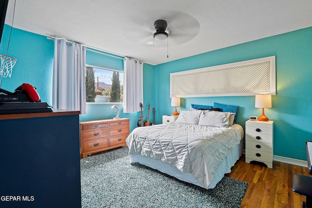 4012 Hastings Dr, El Paso, TX 79903 - bedroom featuring wood finished floors, a ceiling fan, and baseboards