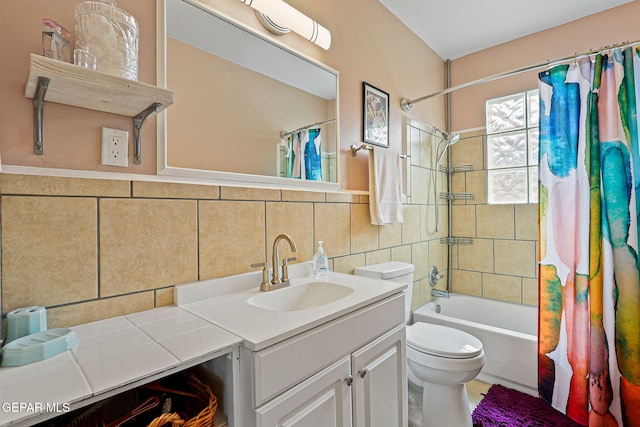 4012 Hastings Dr, El Paso, TX 79903 - bathroom featuring vanity, toilet, shower / bath combination with curtain, tasteful backsplash, and tile walls