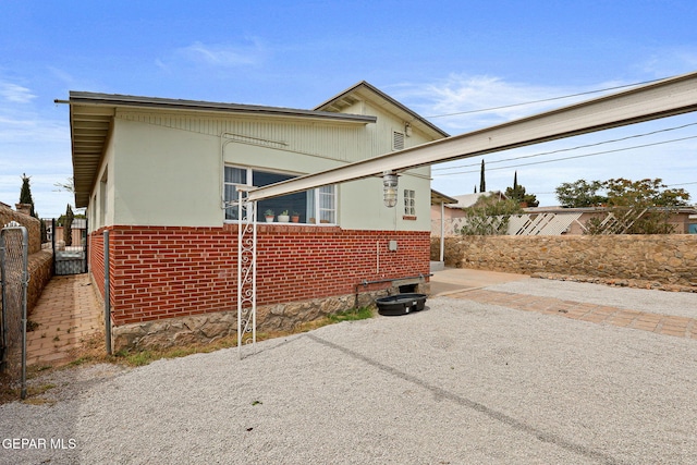 4012 Hastings Dr, El Paso, TX 79903 - view of home's exterior with brick siding and a patio