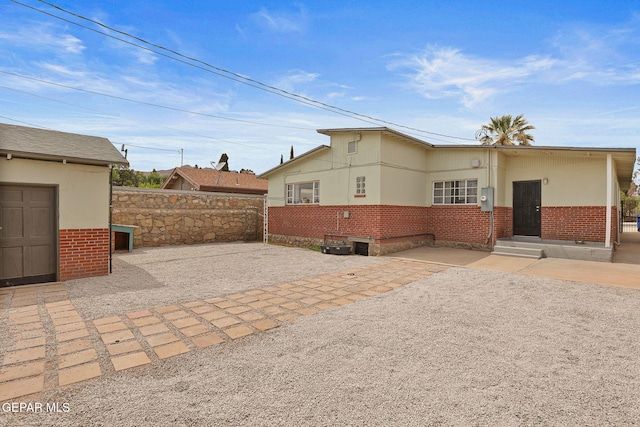 4012 Hastings Dr, El Paso, TX 79903 - view of side of home with brick siding and a patio