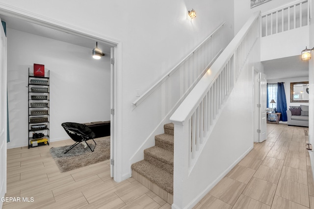532 Gentry Way, El Paso, TX 79928 - stairway featuring baseboards and wood finished floors