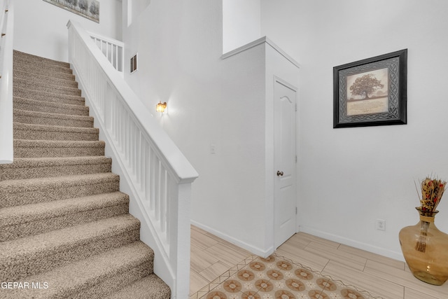 532 Gentry Way, El Paso, TX 79928 - stairs featuring baseboards and wood finish floors